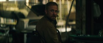 Movie still from “Galveston” (2018), directed by Mélanie Laurent – A person sitting in a chair; Close Up shot, Over the shoulder angle