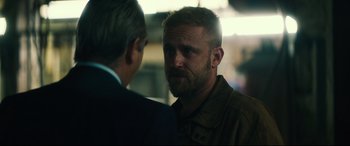 Movie still from “Galveston” (2018), directed by Mélanie Laurent – A man with a beard talking to another man; Close Up shot, Over the shoulder angle