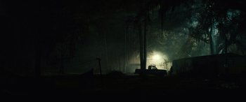 Movie still from “Galveston” (2018), directed by Mélanie Laurent – A truck in the woods at night in the dark; Extreme Wide shot, Low angle