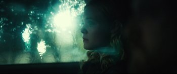 Movie still from “Galveston” (2018), directed by Mélanie Laurent – A woman sitting in a car looking out the window; Close Up shot, Low angle