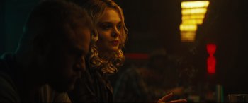 Movie still from “Galveston” (2018), directed by Mélanie Laurent – A woman sitting in a dark room looking at a cell phone; Close Up shot, Over the shoulder angle