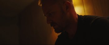 Movie still from “Galveston” (2018), directed by Mélanie Laurent – A person wearing a black shirt; Close Up shot, Low angle