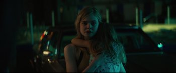 Movie still from “Galveston” (2018), directed by Mélanie Laurent – Two young girls hugging in a dark room; Close Up shot, Over the shoulder angle
