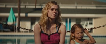 Movie still from “Galveston” (2018), directed by Mélanie Laurent – A woman in a pink top is standing next to a girl; Close Up shot, Over the shoulder angle