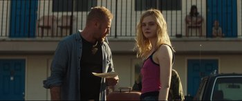 Movie still from “Galveston” (2018), directed by Mélanie Laurent – A man and a woman standing next to each other; Medium shot, Over the shoulder angle