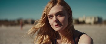 Movie still from “Galveston” (2018), directed by Mélanie Laurent – A person with long blonde hair; Close Up shot, Over the shoulder angle