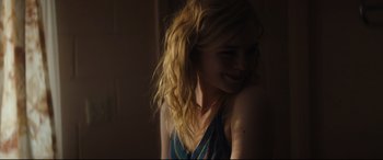Movie still from “Galveston” (2018), directed by Mélanie Laurent – A woman with long blonde hair smiling at the camera; Close Up shot, Over the shoulder angle