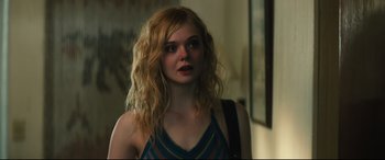 Movie still from “Galveston” (2018), directed by Mélanie Laurent – A beautiful young woman with long , blonde hair; Close Up shot, Over the shoulder angle