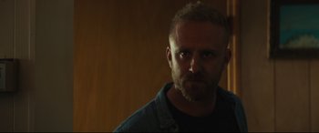 Movie still from “Galveston” (2018), directed by Mélanie Laurent – A person with a beard; Close Up shot, Over the shoulder angle