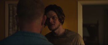 Movie still from “Galveston” (2018), directed by Mélanie Laurent – A man looking at himself in the mirror; Close Up shot, Over the shoulder angle