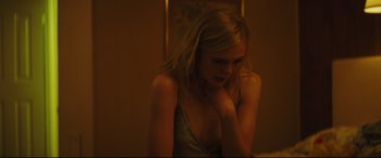 Movie still from “Galveston” (2018), directed by Mélanie Laurent – A beautiful young lady sitting in front of a mirror; Close Up shot, Over the shoulder angle