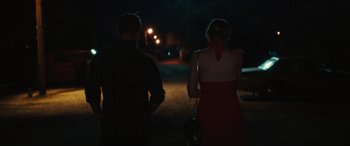 Movie still from “Galveston” (2018), directed by Mélanie Laurent – A man and a woman standing in the street at night; Medium shot, Over the shoulder angle