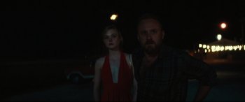 Movie still from “Galveston” (2018), directed by Mélanie Laurent – A man and a woman standing next to each other in the dark; Medium shot, Over the shoulder angle