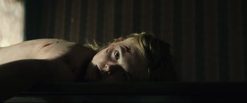 Movie still from “Galveston” (2018), directed by Mélanie Laurent – A young girl with a bruise on her face is laying in bed; Close Up shot, Low angle