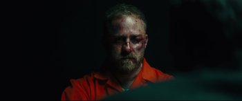 Movie still from “Galveston” (2018), directed by Mélanie Laurent – A person wearing a red shirt; Close Up shot, Over the shoulder angle