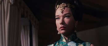 Movie still from “Gambit” (1966), directed by Ronald Neame – A person wearing a dress; Close Up shot, Low angle