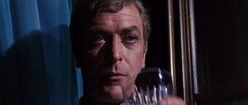 Movie still from “Gambit” (1966), directed by Ronald Neame – A person holding a fork; Close Up shot, Low angle
