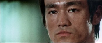 Movie still from “Game of Death” (1978), directed by Robert Clouse – A person's eyes and face; Extreme Close Up shot, Low angle