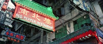 Movie still from “Game of Death” (1978), directed by Robert Clouse – An asian restaurant sign hanging from the side of a building; Extreme Wide shot, Low angle