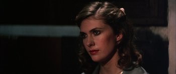 Movie still from “Game of Death” (1978), directed by Robert Clouse – A person wearing a necklace; Close Up shot, Low angle