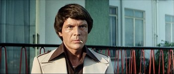 Movie still from “Game of Death” (1978), directed by Robert Clouse – A person wearing a jacket; Close Up shot, Low angle