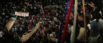 Movie still from “Game of Death” (1978), directed by Robert Clouse – A large crowd of people in a room; Extreme Wide shot, High angle