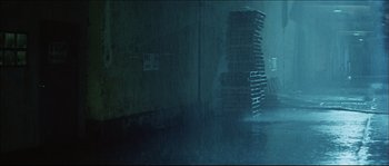 Movie still from “Game of Death” (1978), directed by Robert Clouse – A bunch of boxes stacked on top of each other in a room; Wide shot, Low angle