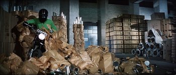Movie still from “Game of Death” (1978), directed by Robert Clouse – A warehouse filled with lots of cardboard boxes; Wide shot, Low angle