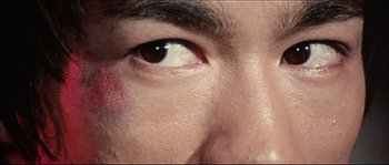 Movie still from “Game of Death” (1978), directed by Robert Clouse – View of a man's eye with bruises; Extreme Close Up shot, High angle