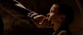 Movie still from “Gangs of New York” (2002), directed by Martin Scorsese – A person feeding a child with a spoon; Close Up shot, High angle