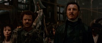 Movie still from “Gangs of New York” (2002), directed by Martin Scorsese – Two men standing next to each other in front of a crowd; Medium shot, Low angle