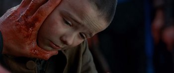 Movie still from “Gangs of New York” (2002), directed by Martin Scorsese – A person looking down at his face; Close Up shot, Overhead angle