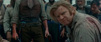 Movie still from “Gangs of New York” (2002), directed by Martin Scorsese – A man with a knife in his mouth; Close Up shot, Over the shoulder angle