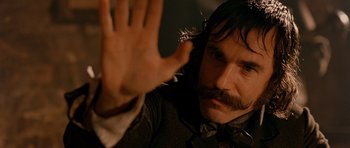 Movie still from “Gangs of New York” (2002), directed by Martin Scorsese – A person holding their hand up; Close Up shot, Over the shoulder angle