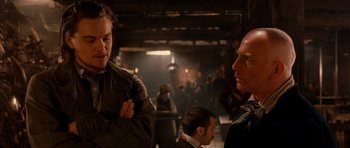 Movie still from “Gangs of New York” (2002), directed by Martin Scorsese – A man and a woman are talking to each other in a room; Medium shot, Over the shoulder angle