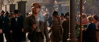 Movie still from “Gangs of New York” (2002), directed by Martin Scorsese – A group of people in old fashioned clothing on a city street; Medium shot, Low angle