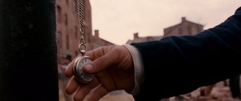 Movie still from “Gangs of New York” (2002), directed by Martin Scorsese – A man holding a pocket watch in his hand; Extreme Close Up shot, High angle