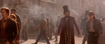 Movie still from “Gangs of New York” (2002), directed by Martin Scorsese – A group of people walking down a street; Medium shot, Over the shoulder angle