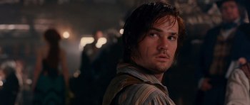 Movie still from “Gangs of New York” (2002), directed by Martin Scorsese – A person wearing a striped shirt; Close Up shot, Over the shoulder angle