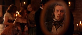 Movie still from “Gangs of New York” (2002), directed by Martin Scorsese – A group of people standing in a room; Close Up shot, Over the shoulder angle