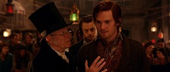 Movie still from “Gangs of New York” (2002), directed by Martin Scorsese – A man talking to another man in front of another man; Close Up shot, Over the shoulder angle