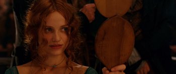 Movie still from “Gangs of New York” (2002), directed by Martin Scorsese – A person holding a wooden object; Close Up shot, Over the shoulder angle