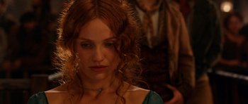 Movie still from “Gangs of New York” (2002), directed by Martin Scorsese – A person with long red curly hair; Close Up shot, Over the shoulder angle