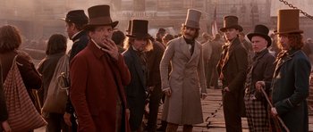 Movie still from “Gangs of New York” (2002), directed by Martin Scorsese – A group of men in top hats and coats; Medium shot, Low angle