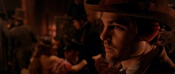 Movie still from “Gangs of New York” (2002), directed by Martin Scorsese – A person wearing a cowboy hat; Close Up shot, Over the shoulder angle