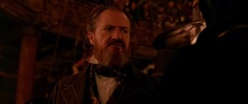 Movie still from “Gangs of New York” (2002), directed by Martin Scorsese – A man with a long beard wearing a suit and tie; Close Up shot, Low angle