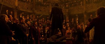 Movie still from “Gangs of New York” (2002), directed by Martin Scorsese – A crowd of people watching a man on a stage; Extreme Wide shot, Low angle