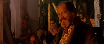Movie still from “Gangs of New York” (2002), directed by Martin Scorsese – A group of men standing next to each other in a room; Close Up shot, Over the shoulder angle