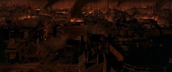 Movie still from “Gangs of New York” (2002), directed by Martin Scorsese – An aerial view of a large city at night; Extreme Wide shot, High angle