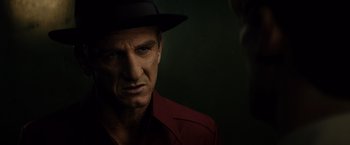 Movie still from “Gangster Squad” (2013), directed by Ruben Fleischer – A person wearing a hat; Close Up shot, Over the shoulder angle